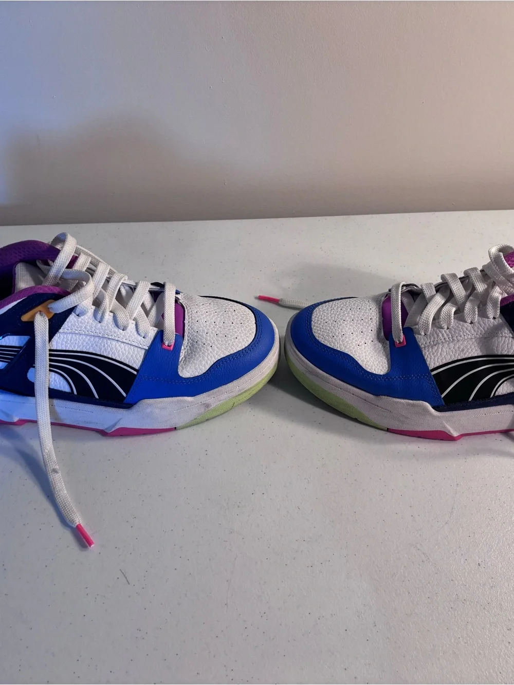 Puma White Sneakers with Blue, Pink and Yellow Accents